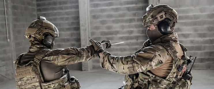 Military and law enforcement personnel training in combat-oriented martial arts techniques for real-world application Military and law enforcement personnel training in combat-oriented martial arts techniques for real-world application