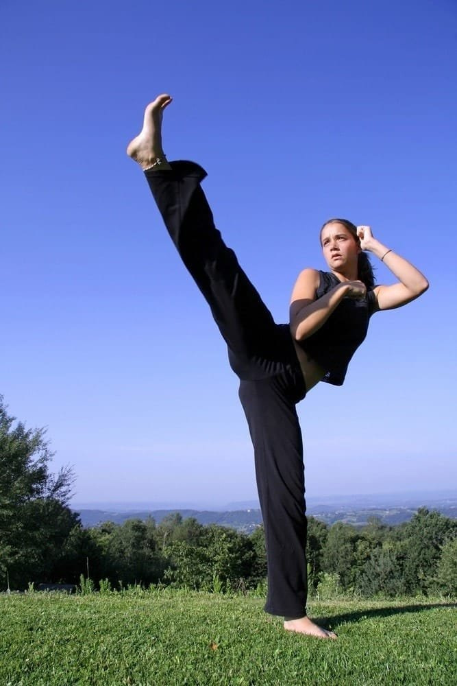 Woman Executing High Kick Woman Executing High Kick