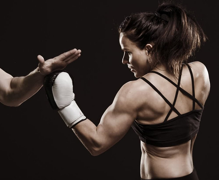 Professional fighter demonstrating core mixed martial arts training techniques
