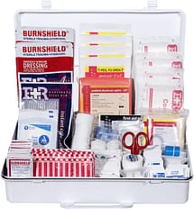 First Aid Kit Open white first aid kit case packed with gauze pads, bandages, a splint, cold packs and scissors