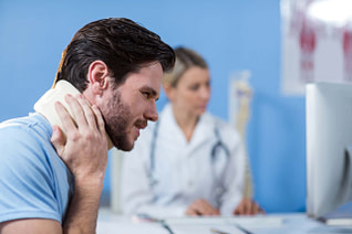 Male Being Seen For A Neck Injury Neck Injury Diagnosis | Fighting Arts Health Lab