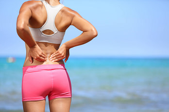 Spine Woman Outside Lower Back Pain Spine Injury Symptoms | Fighting Arts Health Lab