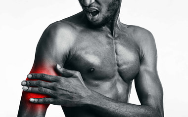 Bicep Man Holding Red Pain II Bicep Injury Symptoms
