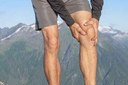 Male Holding Knee Male Holding Knee