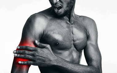 Bicep Man Holding Red Pain II Bicep Injury Symptoms