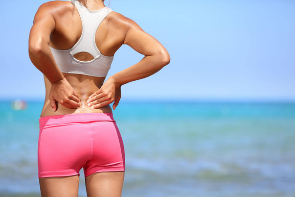Spine Woman Outside Lower Back Pain Spine Injury Symptoms | Fighting Arts Health Lab