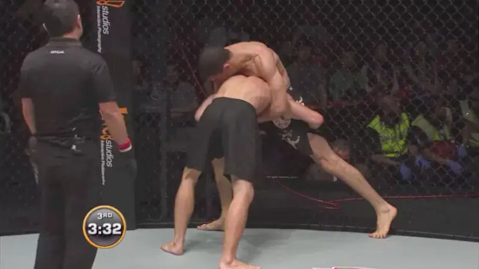 MMA fighter using the Cage Wall to defend takedown MMA fighter using the Cage Wall to defend takedown
