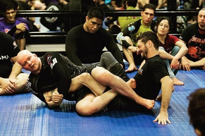 John Danaher demonstrating a leg lock technique John Danaher demonstrating a leg lock technique
