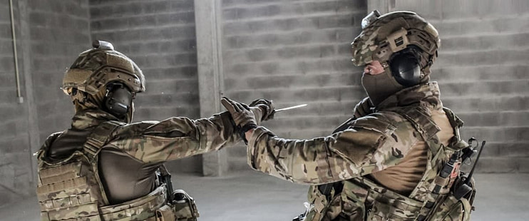 Military and law enforcement personnel training in combat-oriented martial arts techniques for real-world application Military and law enforcement personnel training in combat-oriented martial arts techniques for real-world application